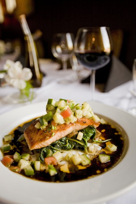 Grilled seafood dish with fresh garnish